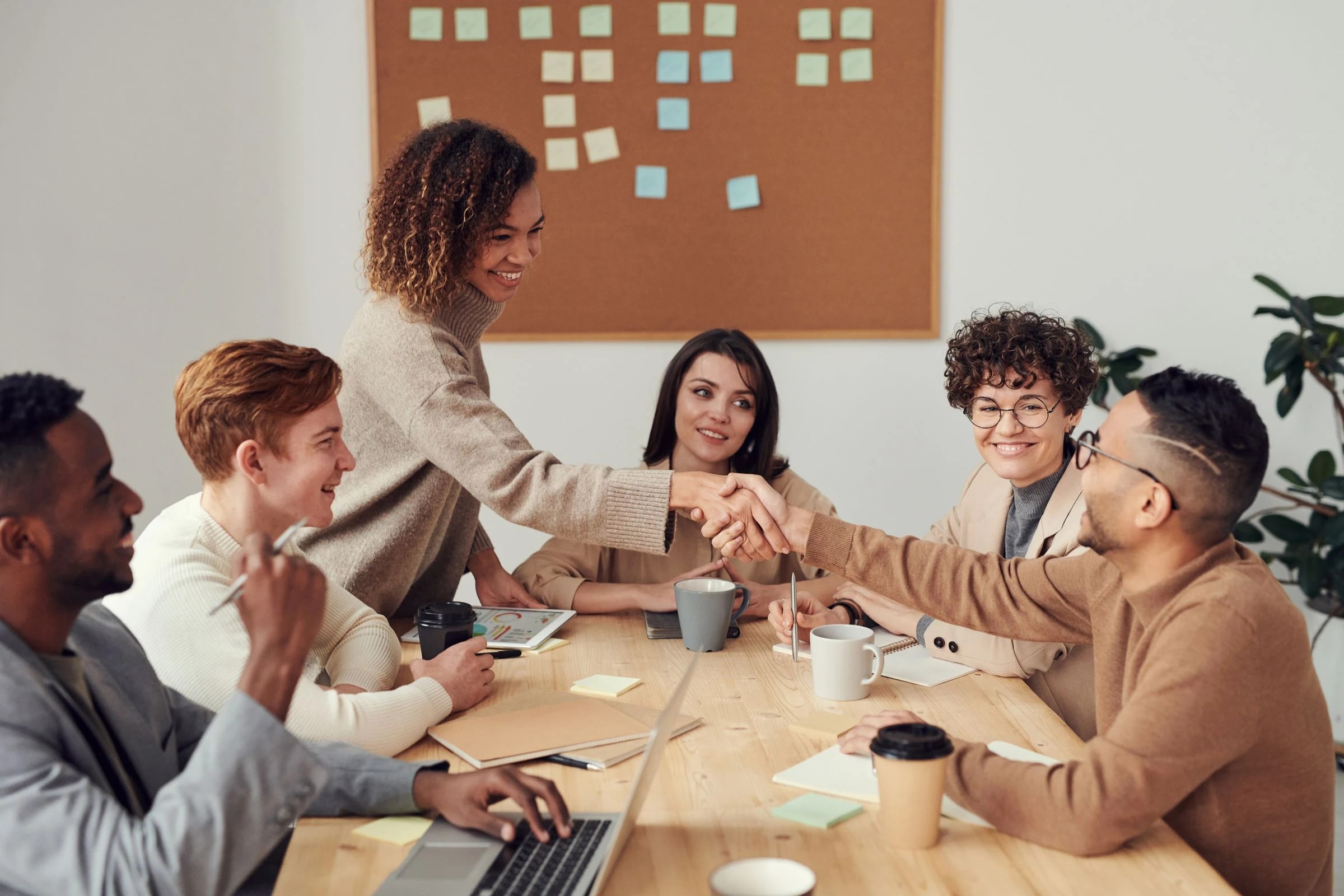 Colleagues discussing a plan around a table