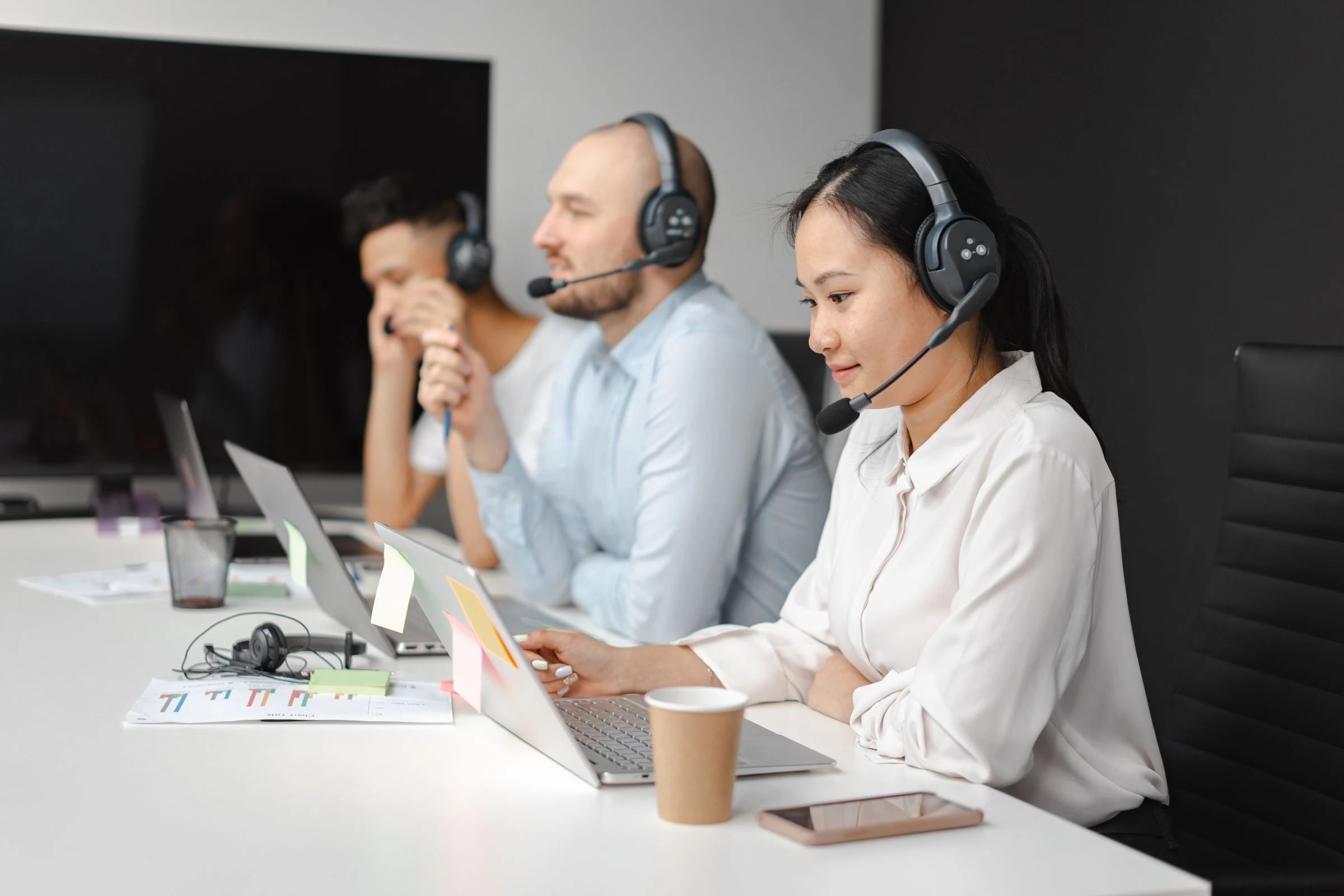Support professionals handling customer communication